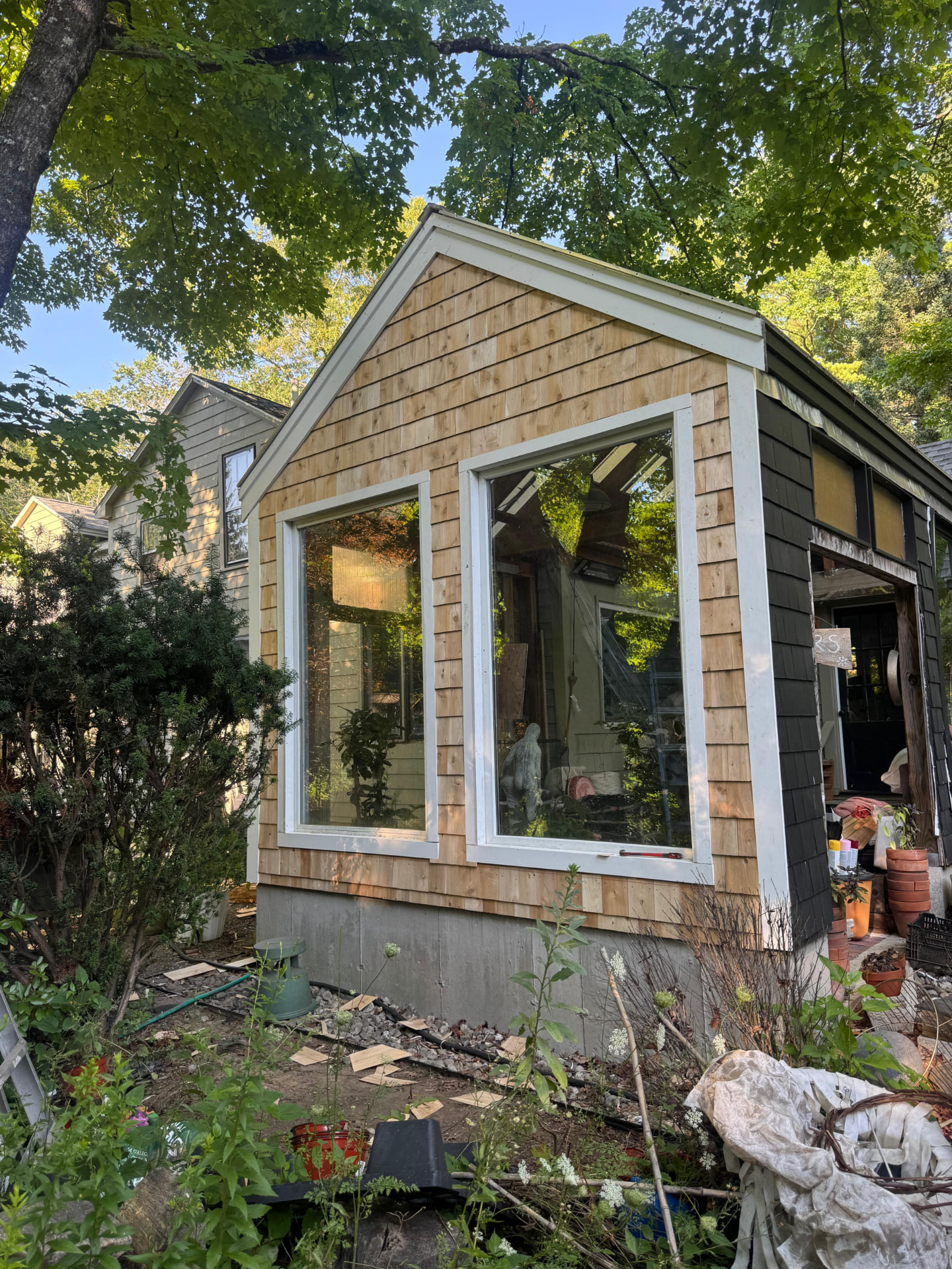 Window installation and trim on a cedar shingle addition by Betel Carpentry Inc